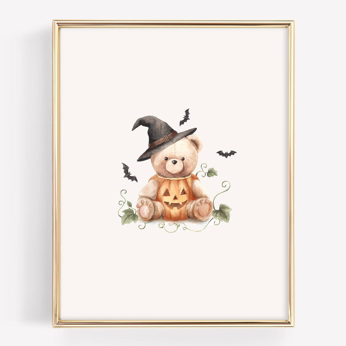 Watercolor Halloween teddy bear with a teddy bear sitting in a jack-o-lantern with a witch hat, and bats around it. The pumpkins also have vines.
