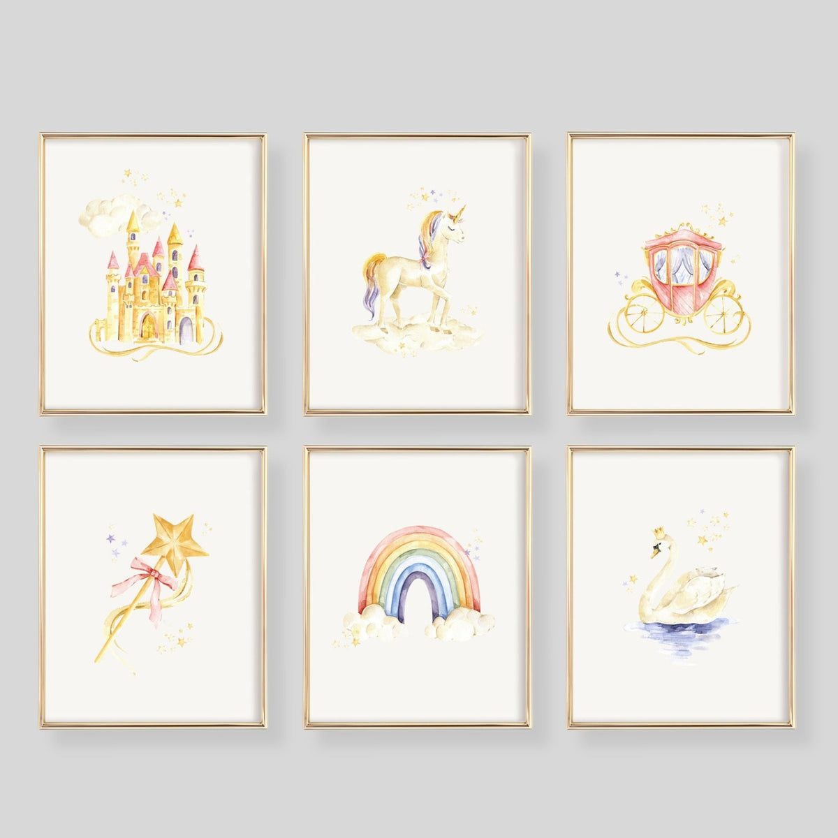 Six framed watercolor art prints arranged in a 2x3 grid on a white wall. The prints feature whimsical illustrations of a castle, unicorn, carriage, wand, rainbow, and swan in soft pastel colors with gold-toned frames.
