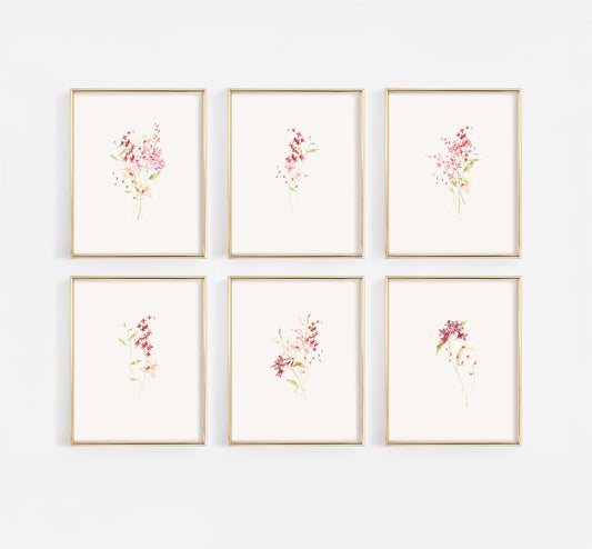 Comprehensive gallery wall set of six gold-framed nursery prints featuring a curated collection of dusty rose and burgundy wildflowers in a modern watercolor style.