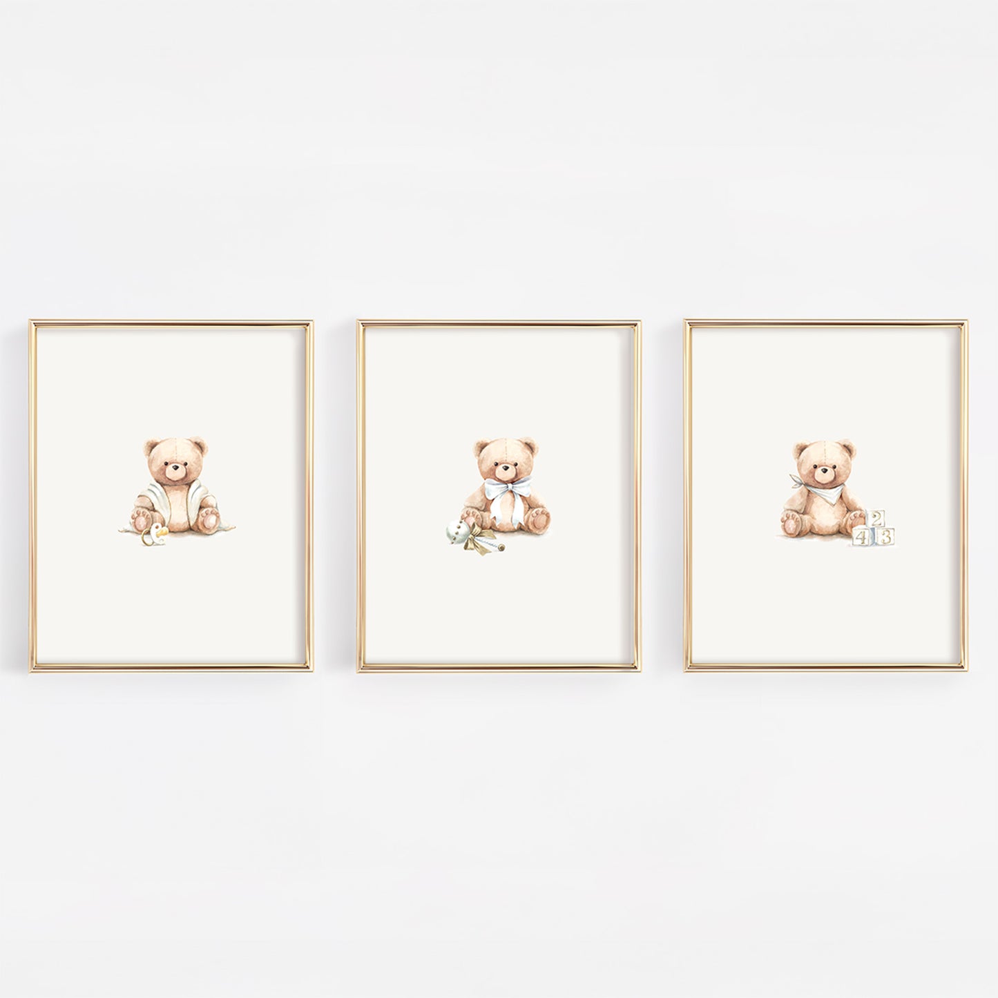 Three framed illustrations of teddy bears on a white wall.