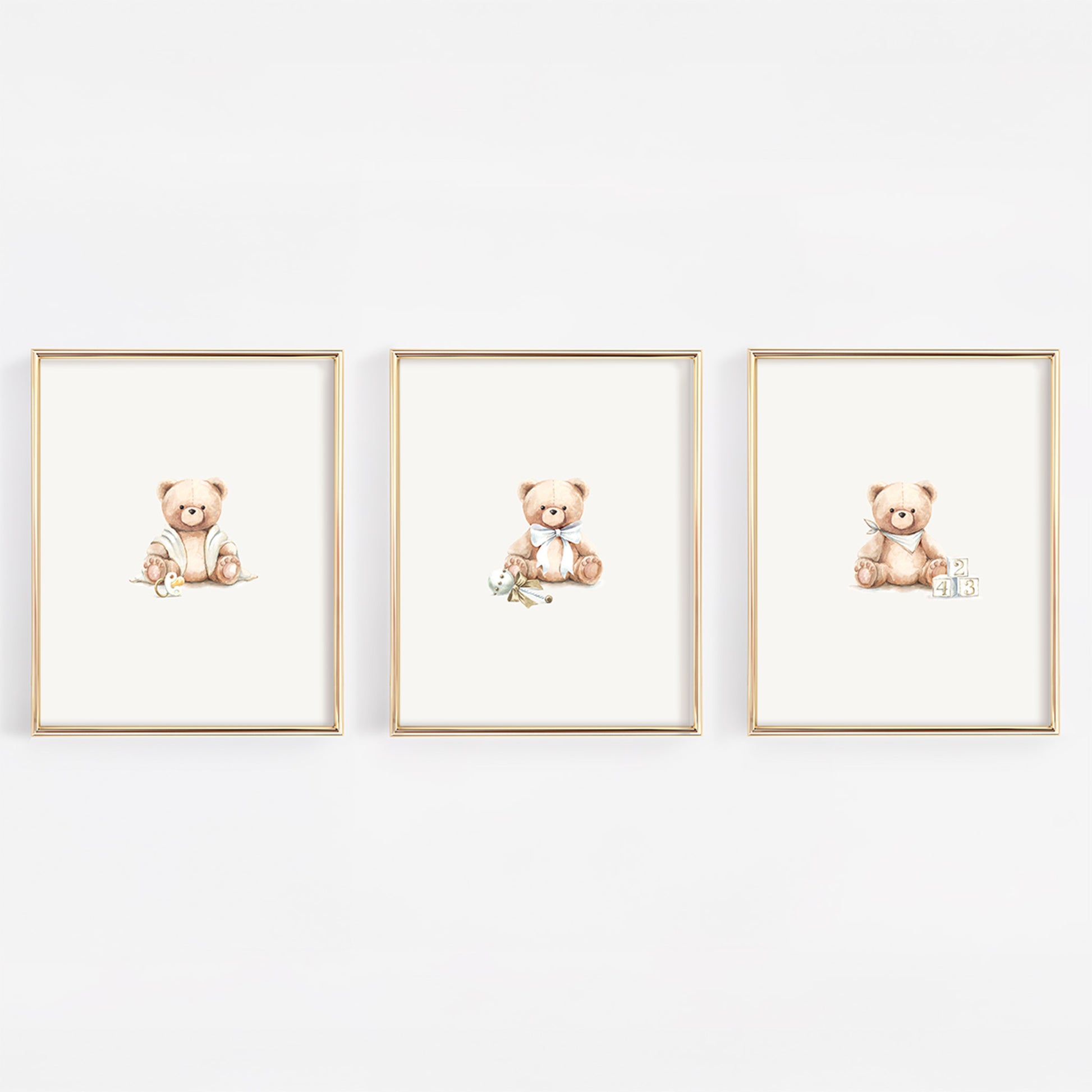 Three framed illustrations of teddy bears on a white wall.