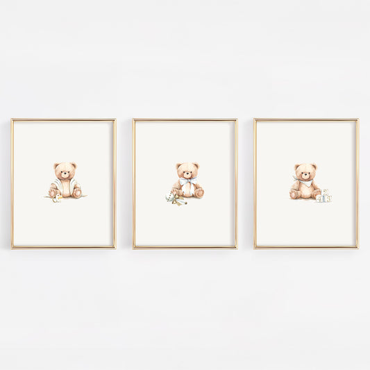 Three framed illustrations of teddy bears on a white wall.