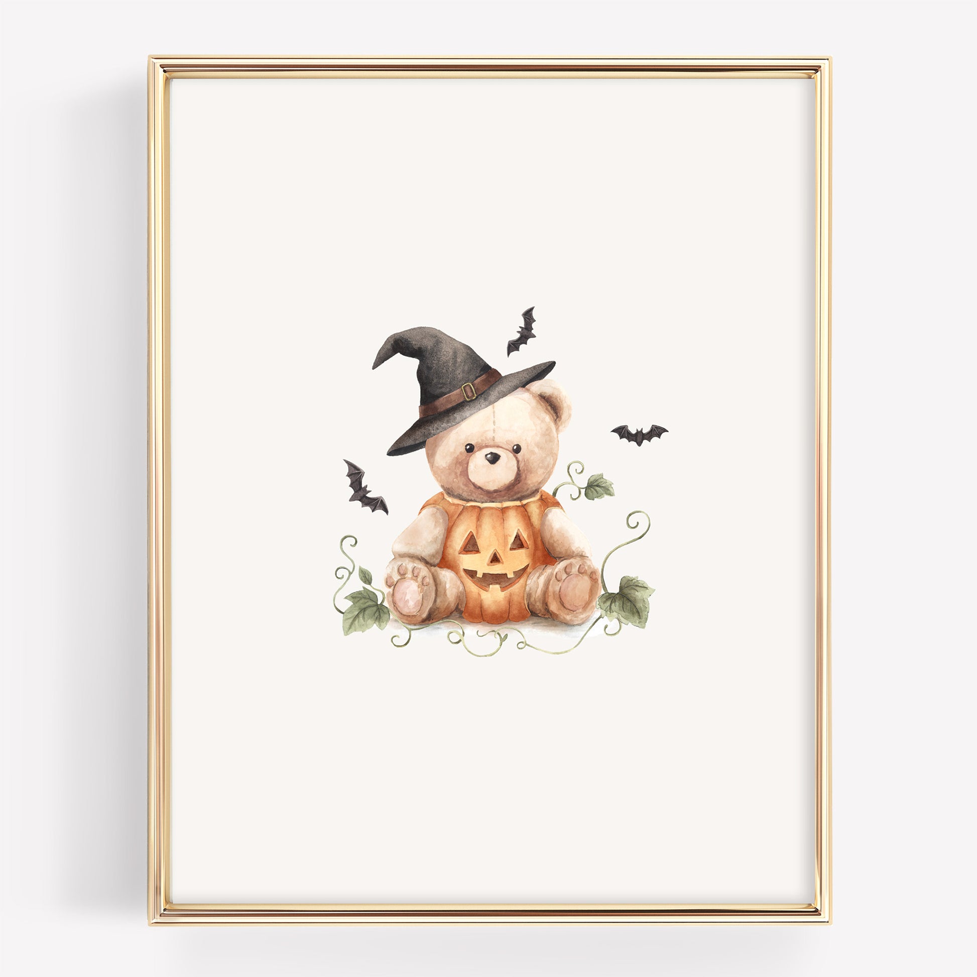 Watercolor Halloween teddy bear with a teddy bear sitting in a jack-o-lantern with a witch hat, and bats around it. The pumpkins also have vines.
