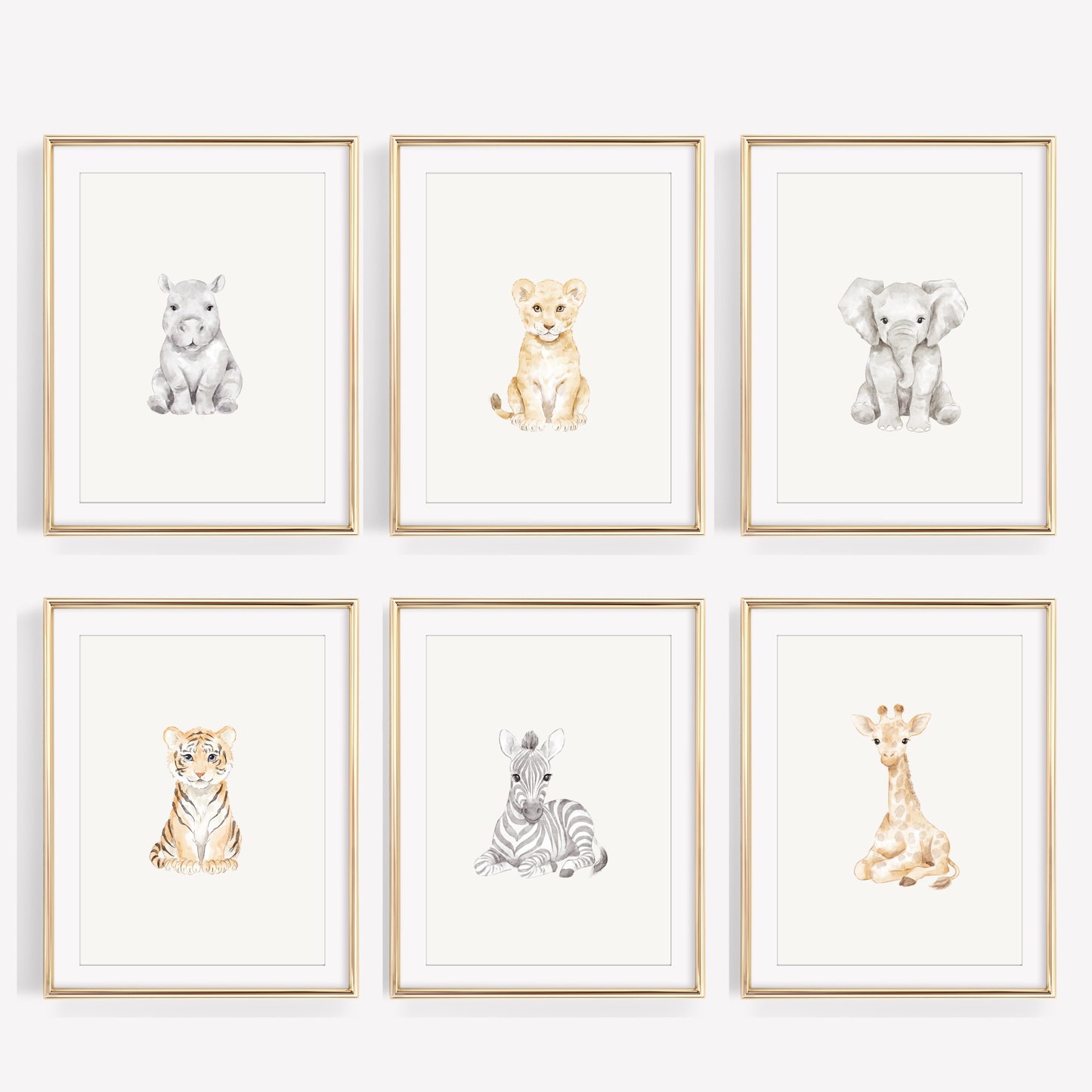 Set of six watercolor safari animal nursery prints featuring a baby lion, giraffe, and elephant on a white wall, neutral jungle themed baby room wall decor.