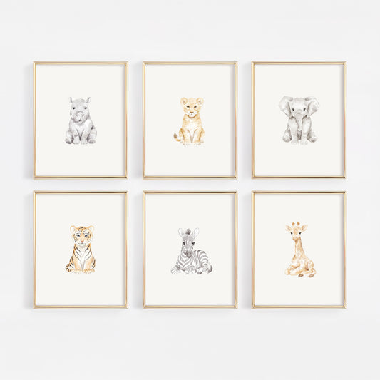 Set of six framed safari animal prints on a white wall