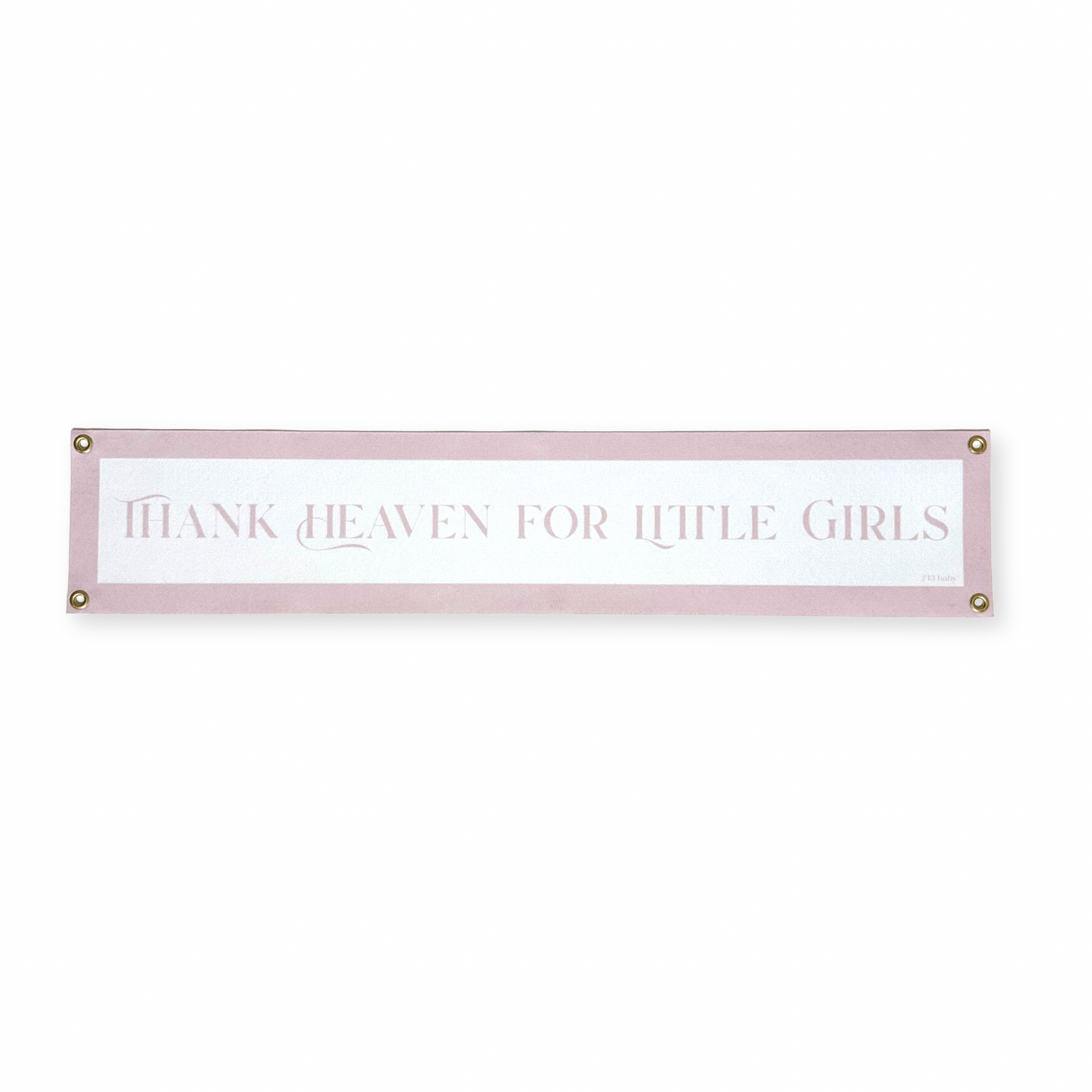 Decorative nursery banner with text 'Thank heaven for little girls' on a white background