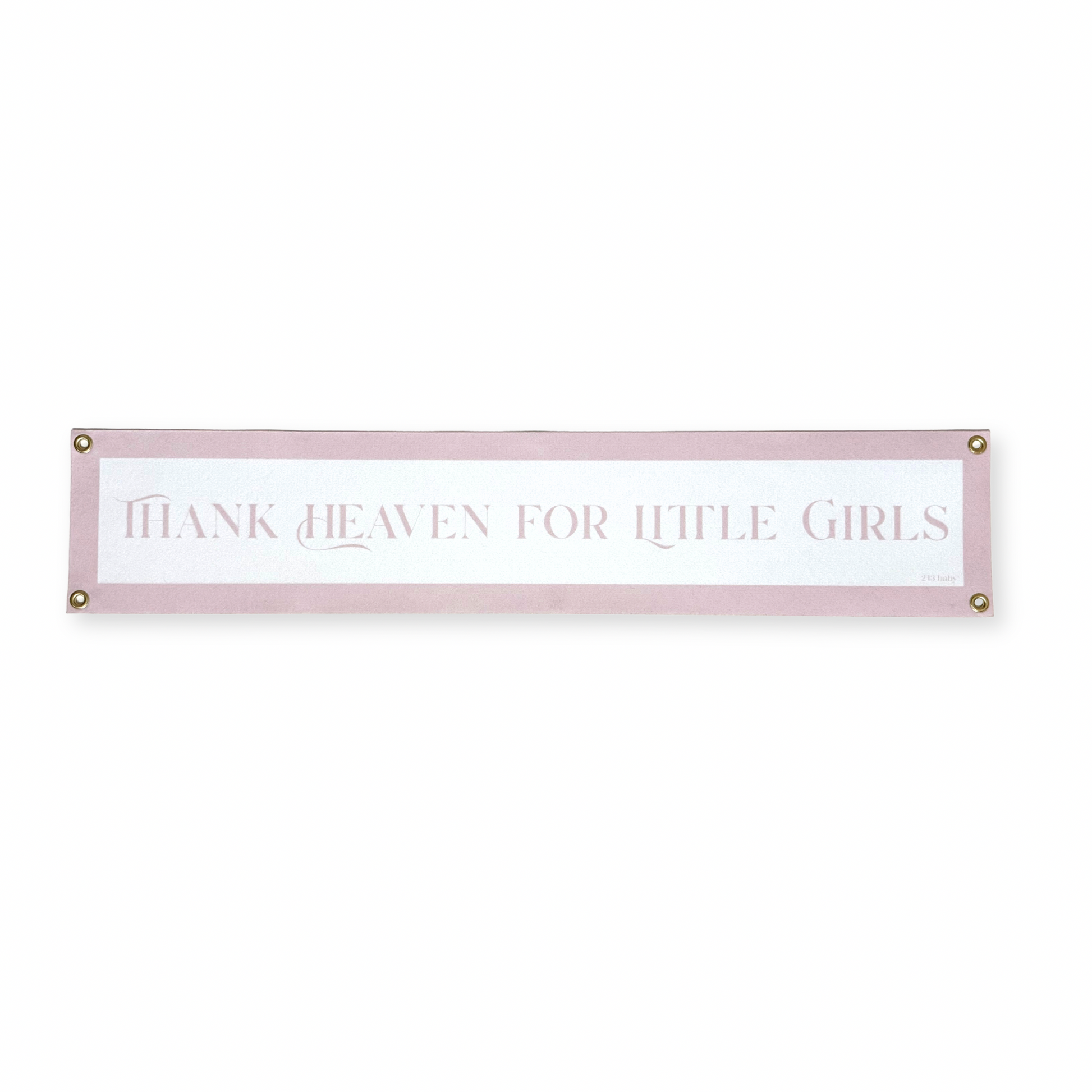 Decorative nursery banner with text 'Thank heaven for little girls' on a white background