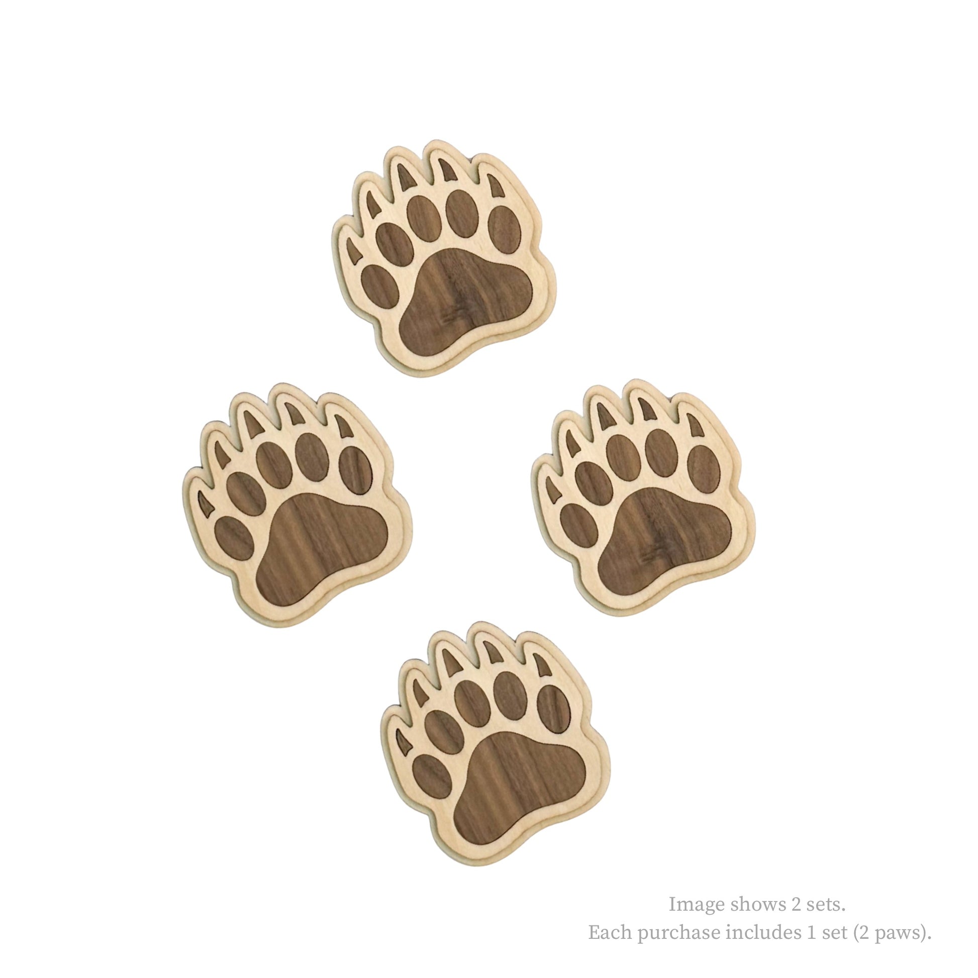 Four wooden paw prints on a white background