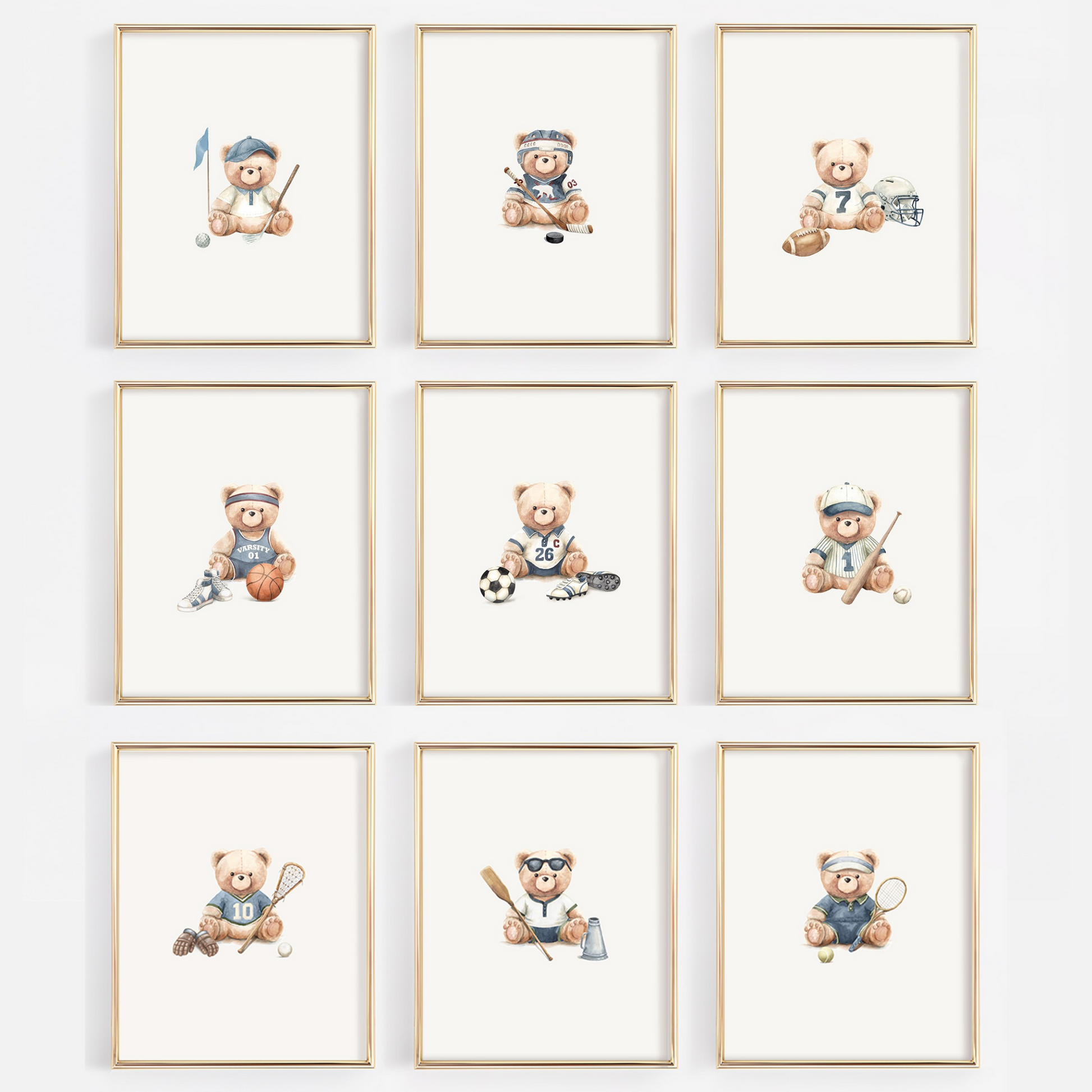 A 3x3 grid of nine framed watercolor prints featuring teddy bears playing sports, displayed on a light gray wall. Each print has a light wood frame and shows a different sport such as soccer, lacrosse, tennis, baseball, football, hockey, basketball, golf, crew, tennis.