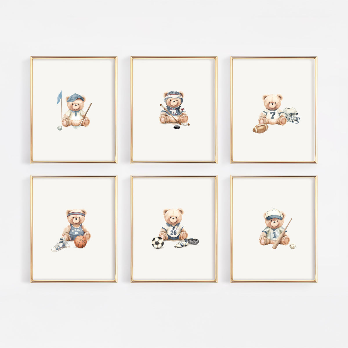 Six framed watercolor prints of teddy bears playing sports, arranged in a 2x3 grid on a light gray wall. Each bear wears a different sporty outfit and holds equipment like a golf club, hockey stick, soccer ball, and hockey puck.
