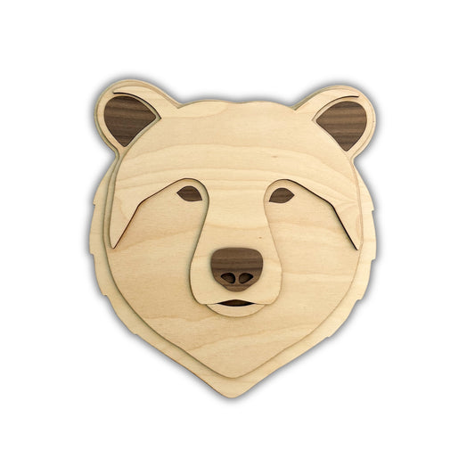 Wooden bear head decoration on a white background