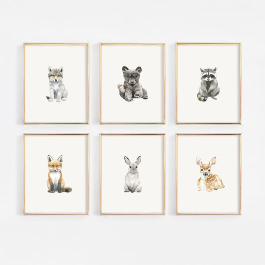 Six woodland creature art prints in gold frames