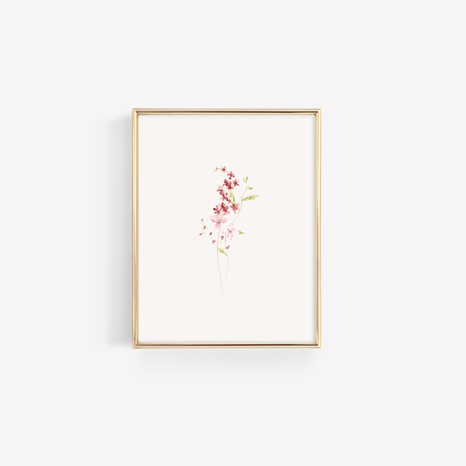 Clean, minimalist botanical print with a simple burgundy wildflower arrangement, styled in a modern metallic gold frame for a sophisticated nursery.