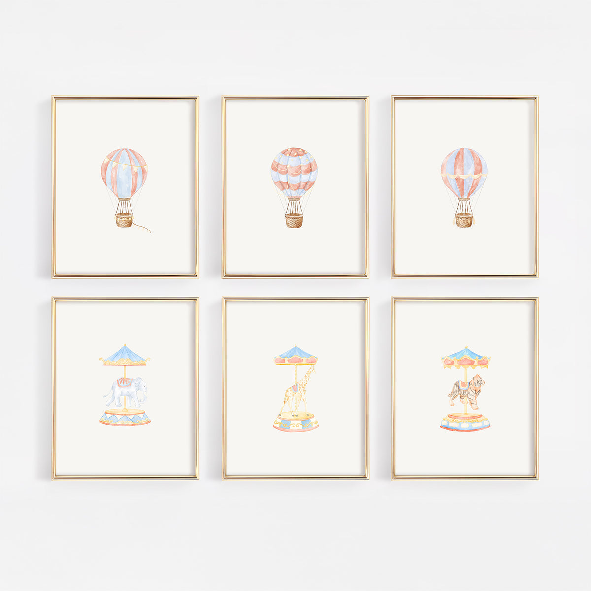Set of six gold-framed whimsical watercolor nursery wall art prints displayed in a 2x3 gallery grid on a white wall, featuring three vintage hot air balloons on the top row and three carnival carousel rides on the bottom row, including carousel elephant, carousel giraffe, and carousel tiger.