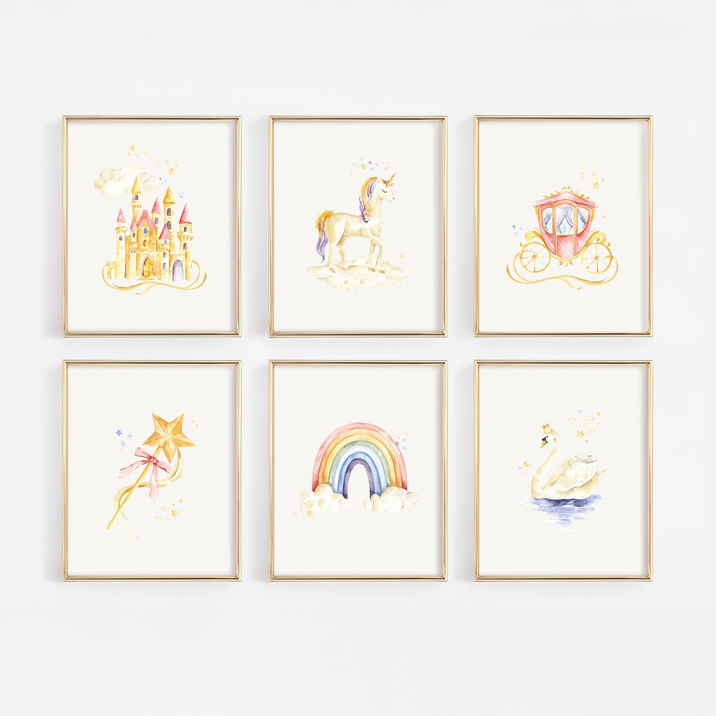Six framed watercolor art prints arranged in a 2x3 grid on a white wall. The prints feature whimsical illustrations of a castle, unicorn, carriage, wand, rainbow, and swan in soft pastel colors with gold-toned frames.