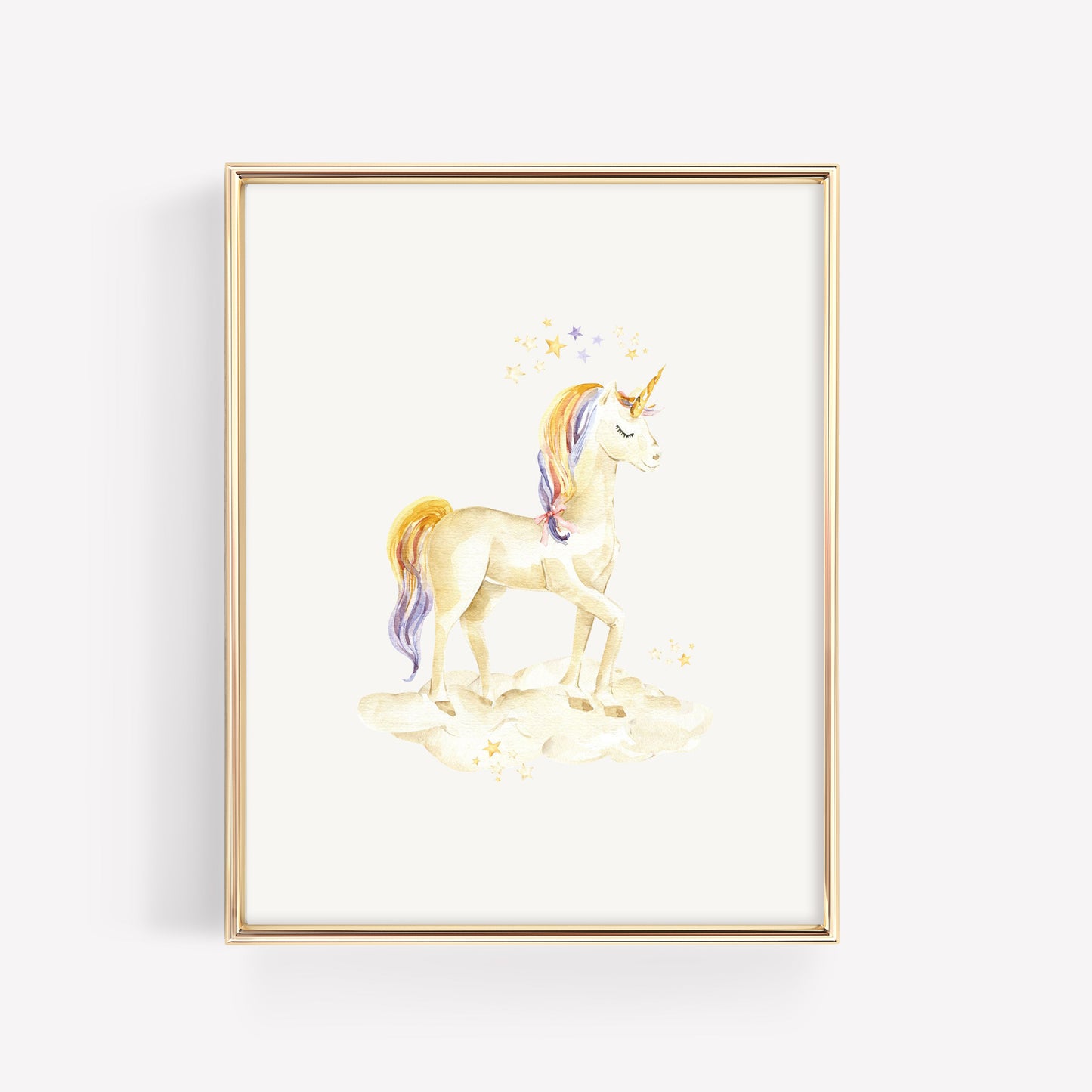 A framed watercolor art print of a unicorn standing on clouds, with a gold frame, shown against a light gray background.