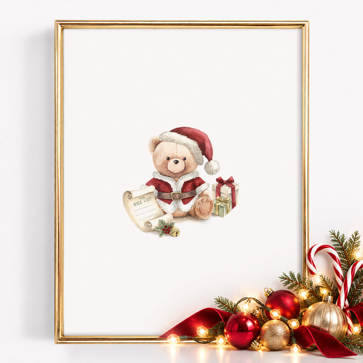 An 8x10-inch gold-framed Christmas watercolor nursery art print centered with a vintage teddy bear dressed as Santa Claus holding a Nice List scroll beside wrapped gifts, styled with evergreen boughs, candy canes, red and gold ornaments, warm fairy lights, and a red velvet ribbon.