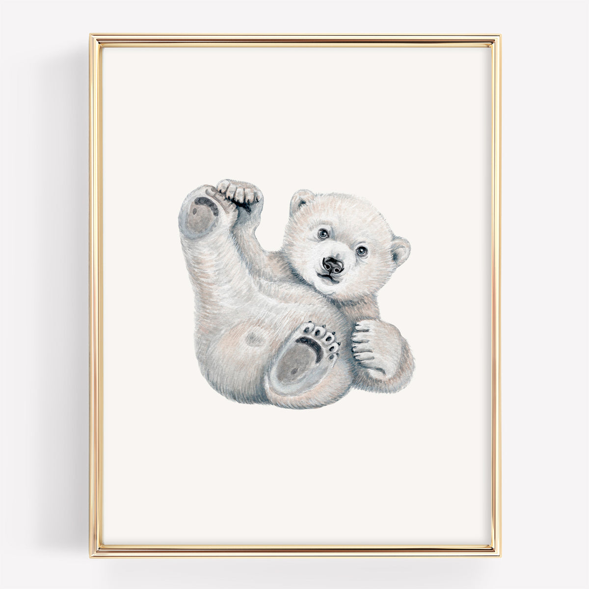Fine art nursery print of a playful polar bear cub rolling on its back with its paws up in the air, illustrated in realistic watercolor.