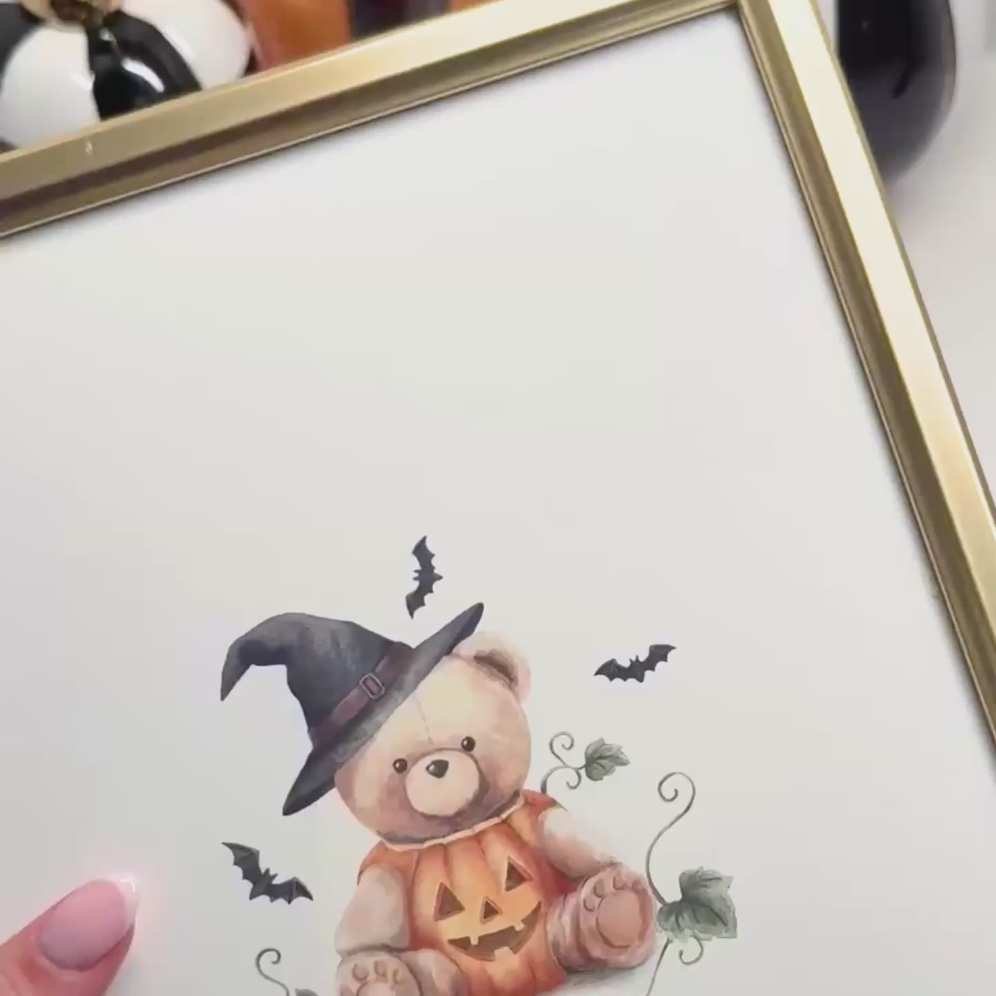 Video of toddler girl decorating for halloween