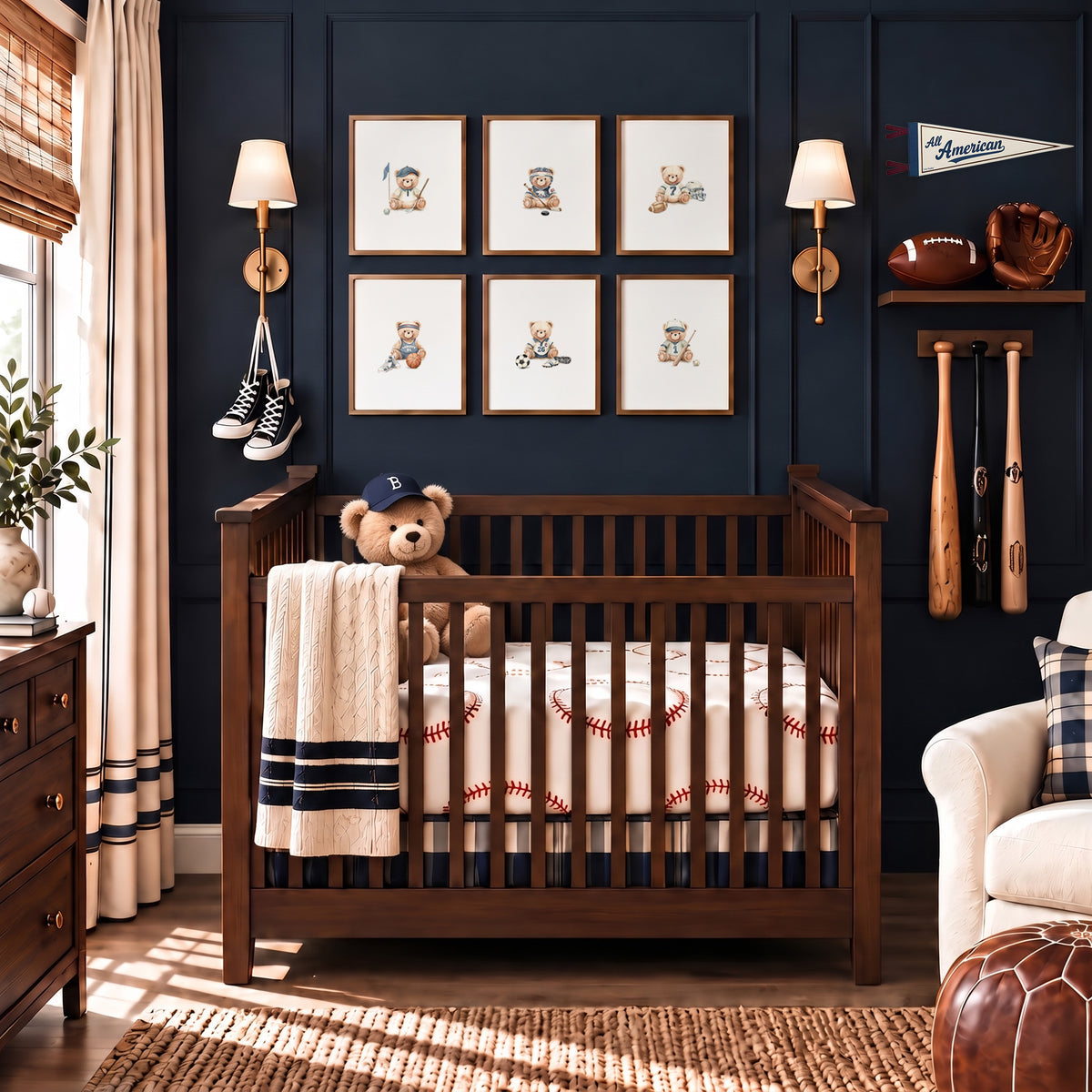 Framed set of 6 vintage varsity sports art prints hung above a wooden crib in a navy blue nursery. 