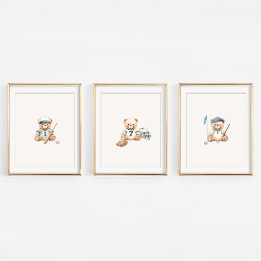 Set of three watercolor varsity sports teddy bear nursery prints featuring baseball, golf, and football themes. Vintage sportsman gallery wall for a baby boy's room.