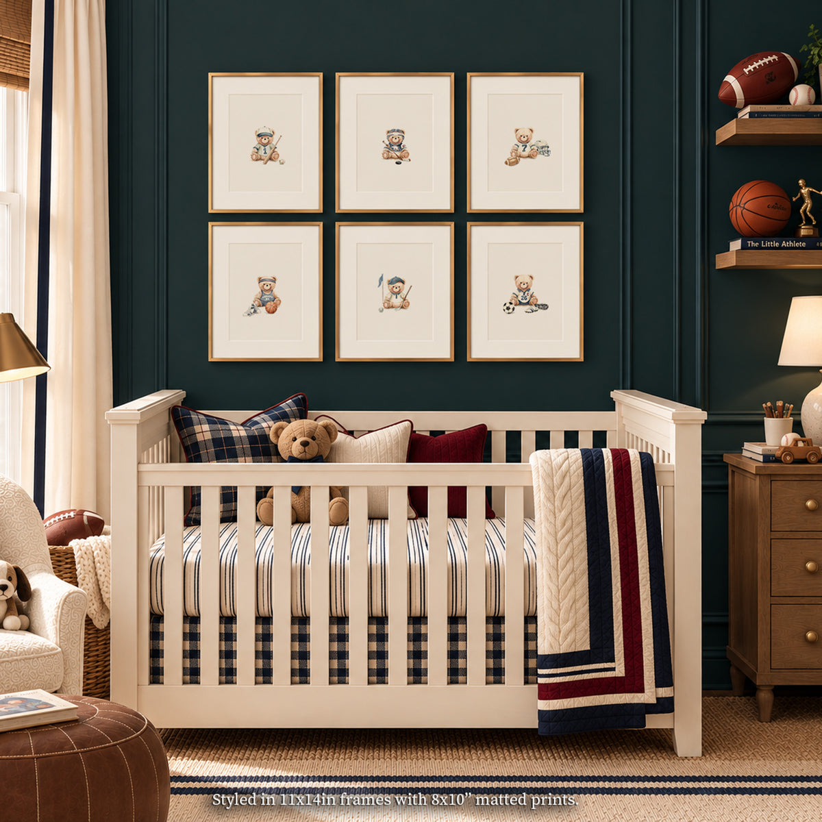 Vintage varsity-themed baby boy nursery mockup featuring a 2x3 grid of framed sports teddy bear prints on a dark navy panelled wall[cite: 22]. Below the art, a warm wood crib is styled with red and navy accents, including a monogrammed varsity quilt, a plaid pillow, a plush teddy bear, and star-patterned sheets, flanked by brass sconces, antique sports memorabilia, and an embroidered ottoman