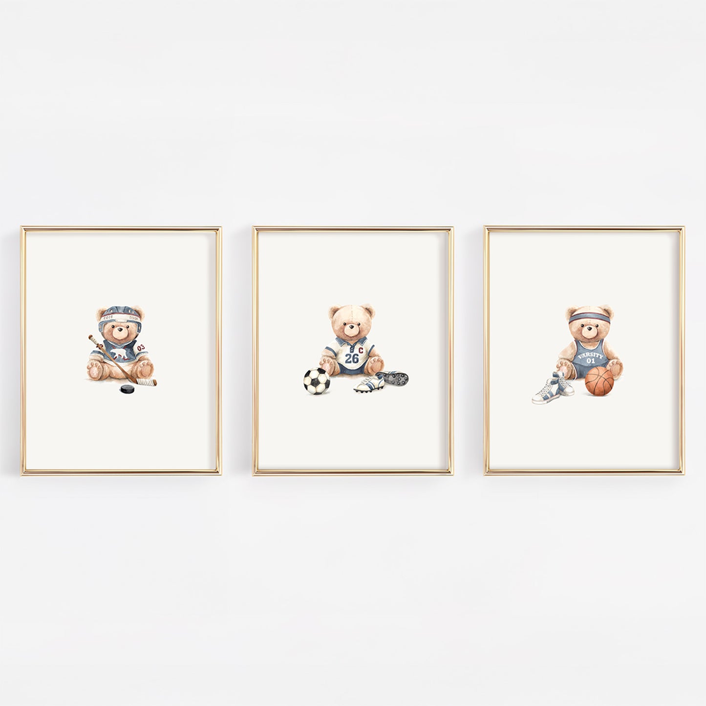 Set of 3 watercolor vintage varsity nursery prints featuring a basketball bear, soccer bear, and hockey bear in soft slate blue for a vintage sports nursery.