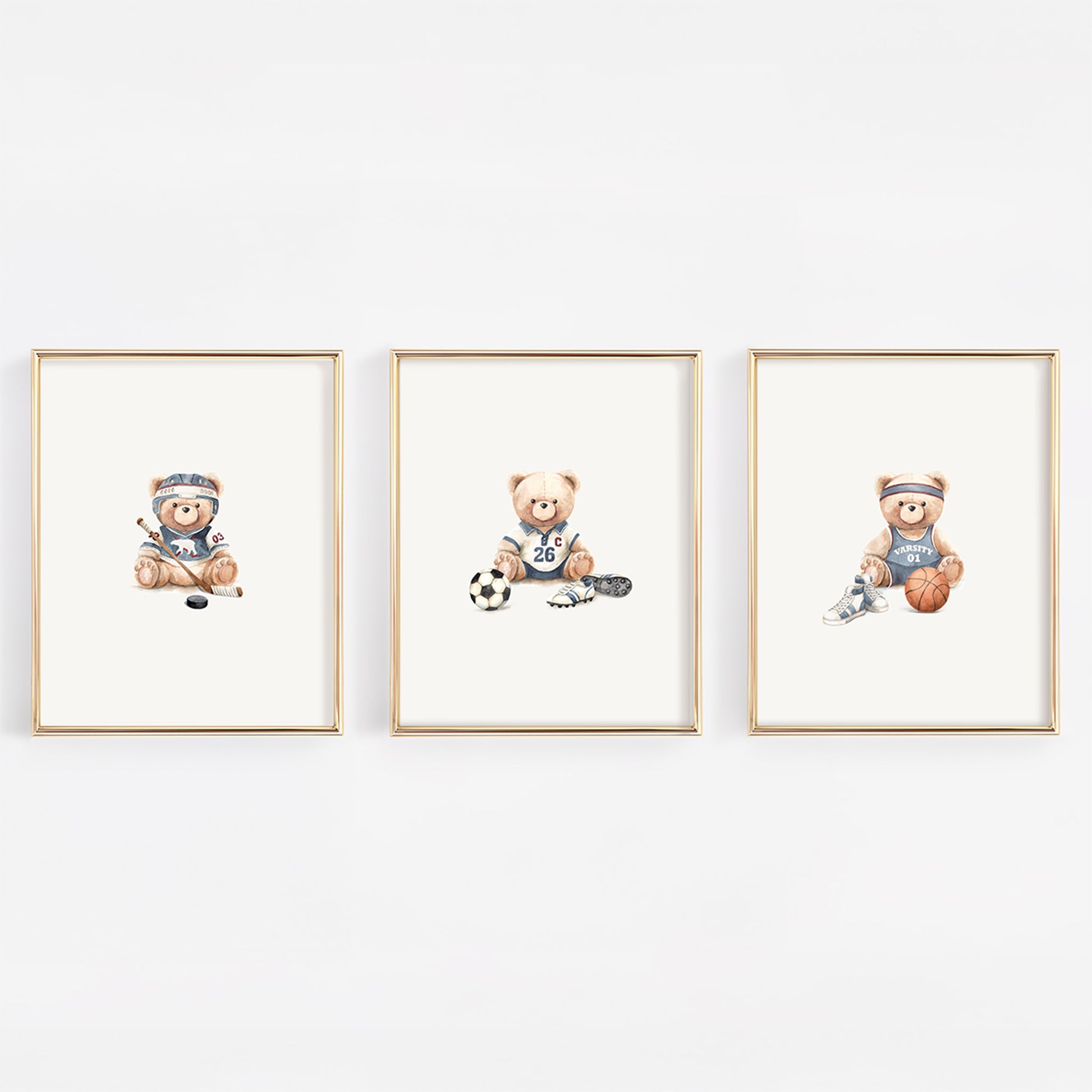Set of 3 watercolor vintage varsity nursery prints featuring a basketball bear, soccer bear, and hockey bear in soft slate blue for a vintage sports nursery.