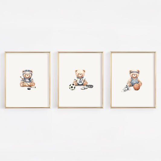 Set of 3 watercolor vintage varsity nursery prints featuring a basketball bear, soccer bear, and hockey bear in soft slate blue for a vintage sports nursery.