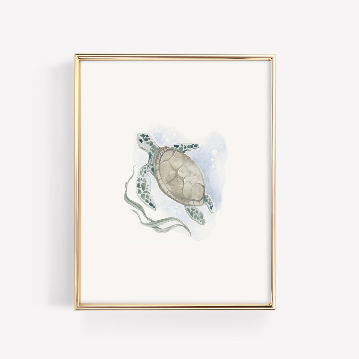 A soft teal and green watercolor sea turtle illustration in a minimalist gold frame, styled as ocean-themed wall art for a baby nursery.