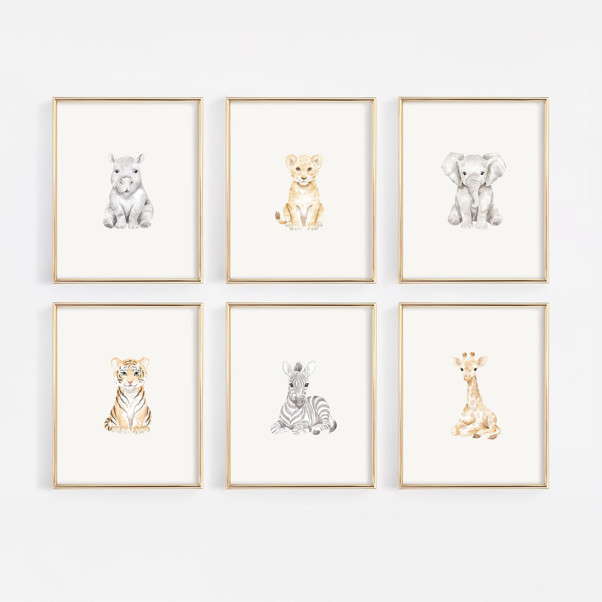 Set of six framed safari animal prints on a white wall including rhino, lion, elephant, tiger, zebra, and giraffe